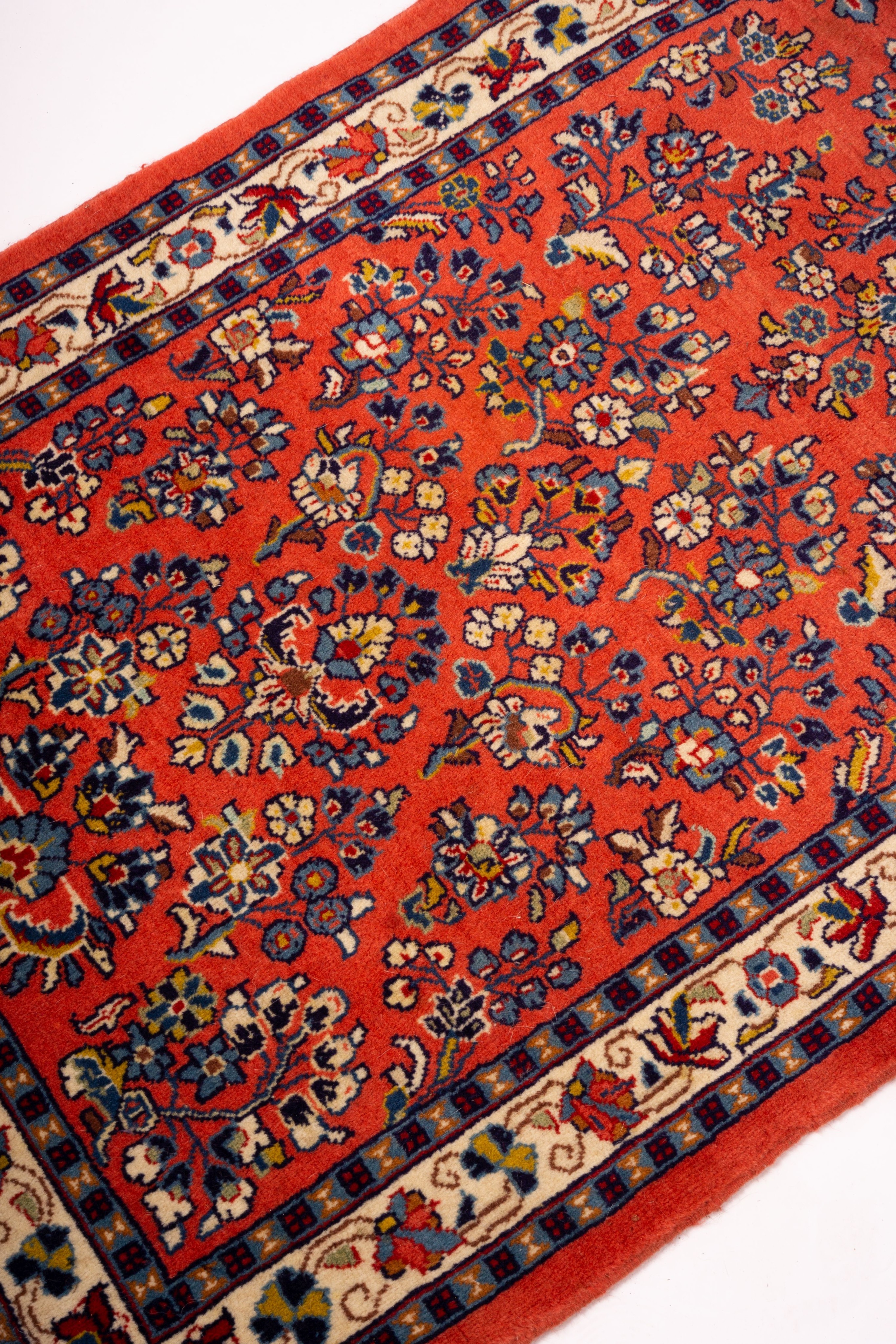 A Persian red ground runner, 202 x 83cm